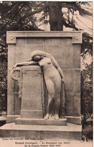Forestier-Postcard-Eymet - Serres-et-Montguyard Black-and-white photo of a grieving woman statue leaning on a pedestal in front of a war memorial inscribed'Aux Morts'.